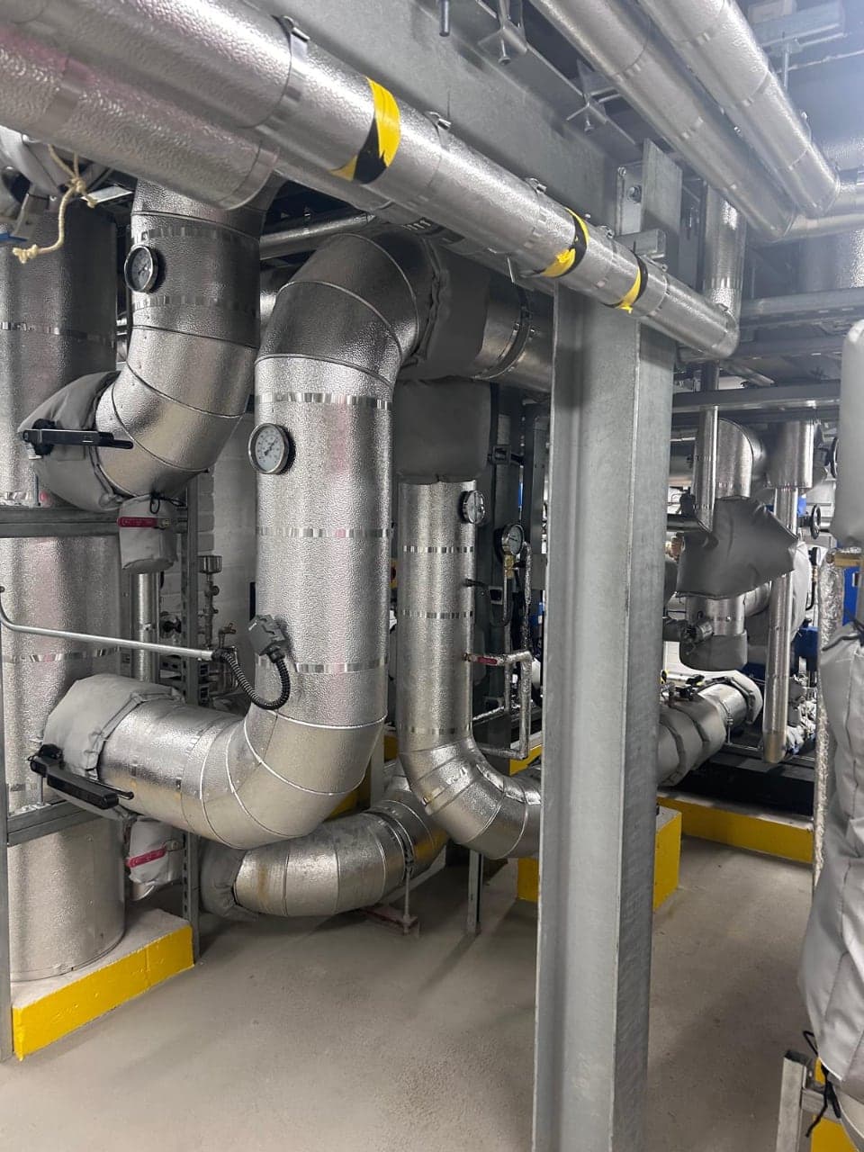 Insulated pipework in a commercial plant room